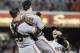 SAN DIEGO, CA - JULY 13: Tim Lincecum #55 of the San Francisco Giants is lifted by Buster Posey #28 after pitching a no-hitter during a baseball game against the San Diego Padres at Petco Park on July 13, 2013 in San Diego, California. (Photo by Denis Poroy/Getty Images)
