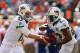 MIAMI GARDENS, FL - DECEMBER 16: Ryan Tannehill #17 of the Miami Dolphins hands off to Reggie Bush #22 during a game against the Jacksonville Jaguars at Sun Life Stadium on December 16, 2012 in Miami Gardens, Florida. (Photo by Mike Ehrmann/Getty Images)