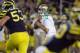 ANN ARBOR, MI - SEPTEMBER 10: Tommy Rees #11 of the Notre Dame Fighting Irish gets ready to throw a second quarter pass behind Ryan Van Bergen #53 of the Michigan Wolverines at Michigan Stadium on September 10, 2010 in Ann Arbor, Michigan. (Photo by Gregory Shamus/Getty Images)