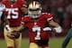 SAN FRANCISCO, CA - JANUARY 12: Quarterback Colin Kaepernick #7 of the San Francisco 49ers runs the ball against nose tackle B.J. Raji #90 of the Green Bay Packers during the NFC Divisional Playoff Game at Candlestick Park on January 12, 2013 in San Francisco, California. (Photo by Stephen Dunn/Getty Images)