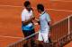 HAMBURG, GERMANY - JULY 20: Federico Delbonis of Argentina (L) and Roger Federer of Switzerland shake hands after their Semi Final match during the International German Open at Rothenbaum on July 20, 2013 in Hamburg, Germany. (Photo by Joern Pollex/Getty Images)