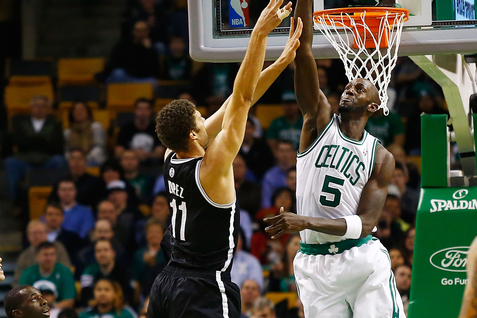 Yi Jianlian and Brook Lopez of the New Jersey Nets look on during