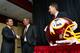 On January 6, 2010, Washington Redskins owner Daniel Snyder shakes hands with new coach Mike Shanahan as GM Bruce Allen looks on at the press conference announcing Shanahan as head coach.
