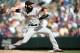 April 12, 2012; Denver, CO, USA; San Francisco Giants pitcher Brian Wilson delivers a pitch during the ninth inning against the Colorado Rockies at Coors Field. The Giants won 4-2. Mandatory Credit: Chris Humphreys-USA TODAY Sports