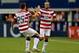 ARLINGTON, TX - JULY 24: Landon Donovan #10 of the United States celebrates his goal with Matt Besler #25 against Honduras during the CONCACAF Gold Cup semifinal match at Cowboys Stadium on July 24, 2013 in Arlington, Texas. (Photo by Ronald Martinez/Getty Images)