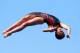 BARCELONA, SPAIN - JULY 24: Yajie Si of China competes in the Women's 10m Platform Diving semi final on day five of the 15th FINA World Championships at Piscina Municipal de Montjuic on July 24, 2013 in Barcelona, Spain. (Photo by Alexander Hassenstein/Getty Images)