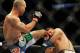 Jul 27, 2013; Seattle, WA, USA; Robbie Lawler (red tape) lands a kick to the head of Bobby Voelker (blue tape) during their welterweight bout at Key Arena. Lawler won by a TKO in the second round. Mandatory Credit: Jayne Kamin-Oncea-USA TODAY Sports