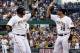 Jul 29, 2013; Pittsburgh, PA, USA; Pittsburgh Pirates third baseman Pedro Alvarez (left) is greeted at home plate by second baseman Neil Walker (18) after Alvarez hit a three run home run against the St. Louis Cardinals during the first inning at PNC Park. Mandatory Credit: Charles LeClaire-USA TODAY Sports
