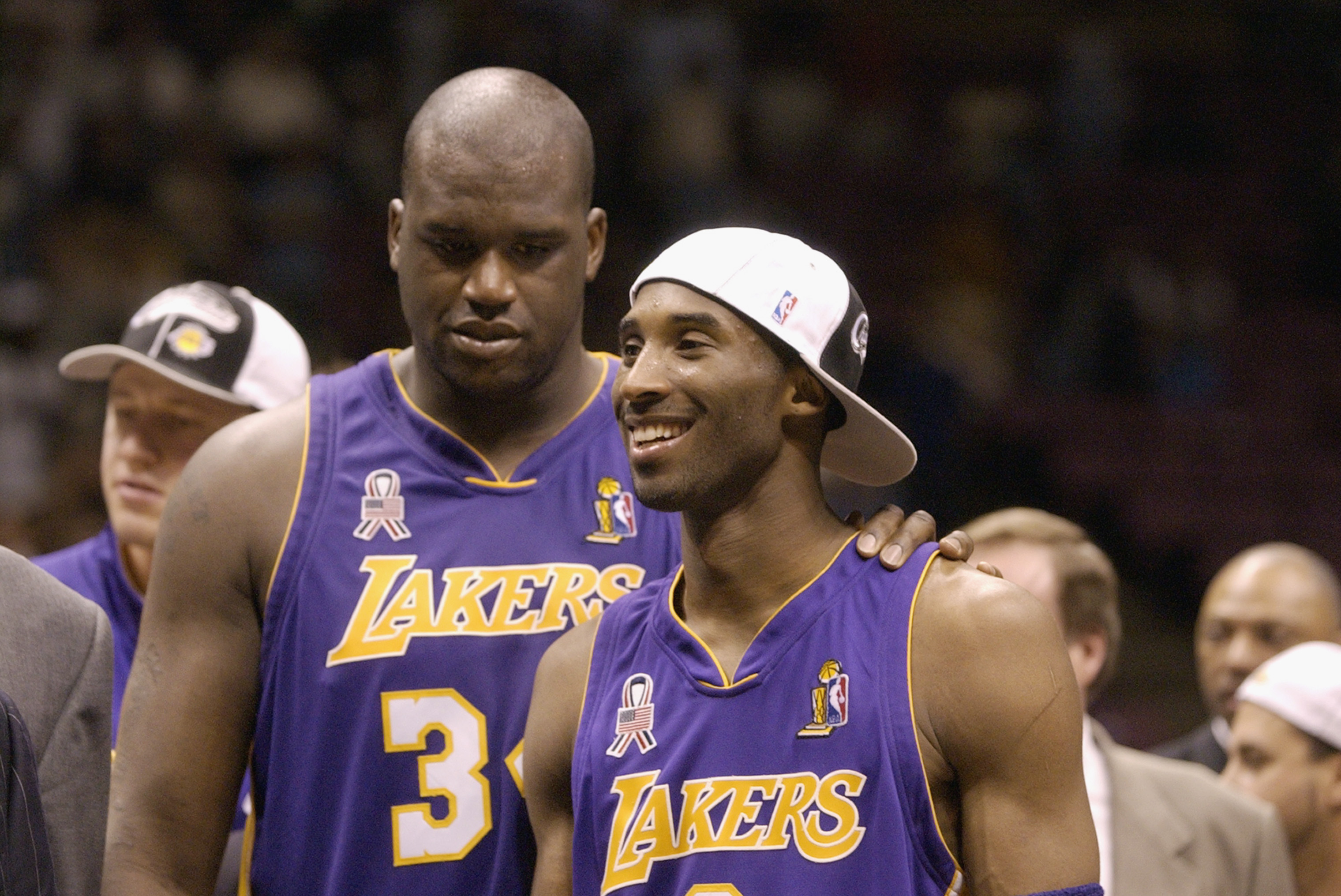 List of players with jerseys retired by the Los Angeles Lakers: Kobe Bryant,  Shaquille O'Neal, Magic
