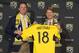 Jul 30, 2013; Columbus, OH, USA; Former majority owner Clark Hunt of Hunt Sports Group presents Anthony Precourt of new owner Precourt Sports Ventures with a with a named Crew jersey at a press conference announcing the sale of the team at Crew Stadium. Mandatory Credit: Greg Bartram-USA TODAY Sports