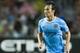 SO KON PO, HONG KONG - JULY 27: David Silva of Manchester City runs with the ball during the Barclays Asia Trophy Final match between Manchester City and Sunderland at Hong Kong Stadium on July 27, 2013 in So Kon Po, Hong Kong. (Photo by Victor Fraile/Getty Images)