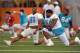 Jul 24, 2013; Davie, FL, USA; Miami Dolphins defensive end Cameron Wake (left) talks with teammate defensive tackle Randy Starks (right) during training camp at the Doctors Hospital Training Facility at Nova Southeastern University. Mandatory Credit: Steve Mitchell-USA TODAY Sports