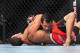 August 4, 2012; Los Angeles, CA, USA; Rani Yahya grabs Josh Grispi during the featherweight match at Staples Center. Mandatory Credit: Gary A. Vasquez-USA TODAY Sports