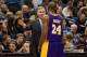 Feb 1, 2013; Minneapolis, MN, USA; Los Angeles Lakers head coach Mike D'Antoni (left) talks with guard Kobe Bryant (right) during the third quarter against the Minnesota Timberwolves at the Target Center. The Lakers defeated the Timberwolves 111-100. Mandatory Credit: Brace Hemmelgarn-USA TODAY Sports