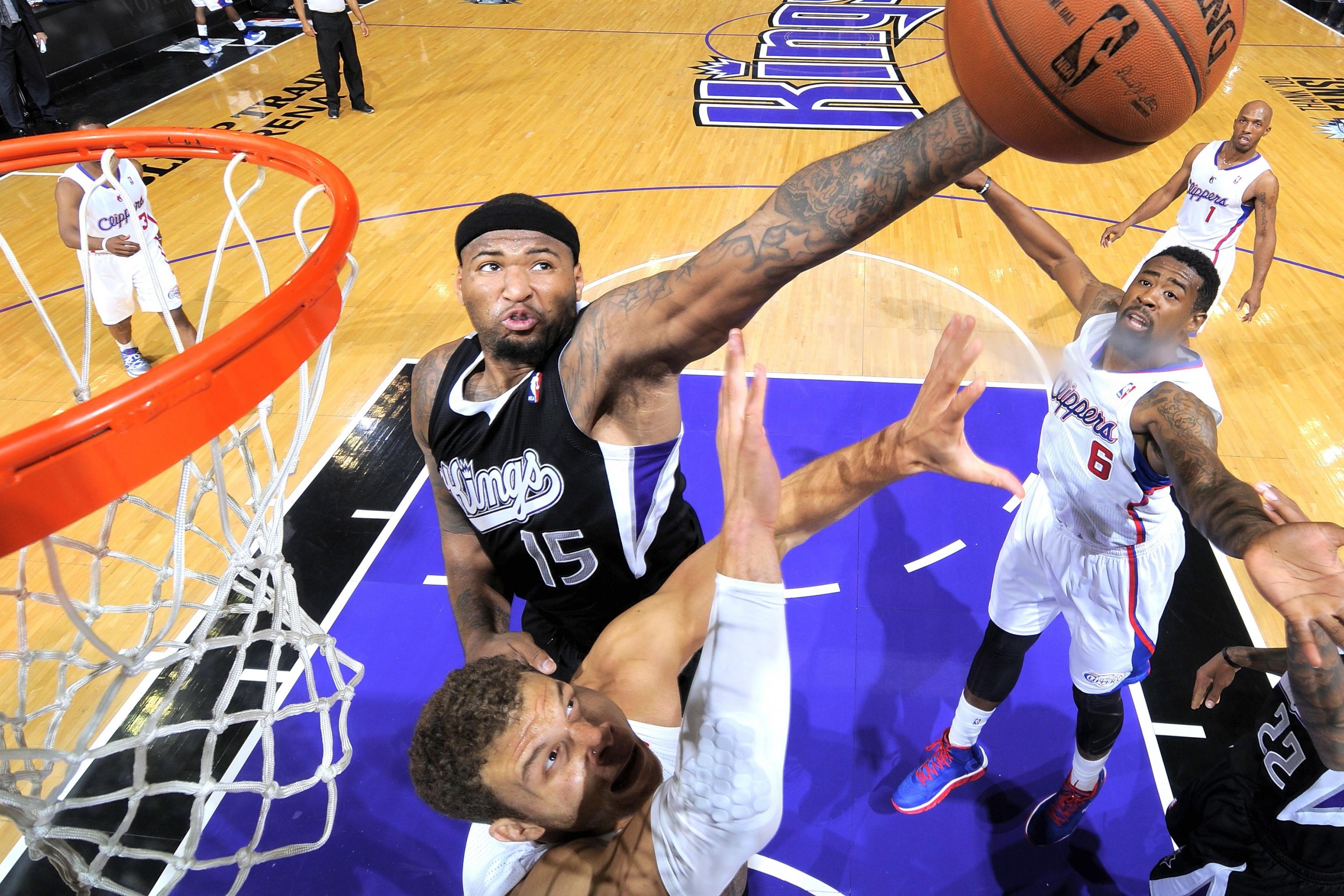 Kevin Durant giving away true height by standing next to DeMarcus Cousins