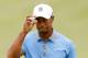 AKRON, OH - AUGUST 02: Tiger Woods reacts after a birdie putt on the third green during the Second Round of the World Golf Championships-Bridgestone Invitational at Firestone Country Club South Course on August 2, 2013 in Akron, Ohio. (Photo by Gregory Shamus/Getty Images)