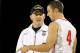 CHARLESTON, SC - NOVEMBER 09: Head coach Buzz Williams of the Marquette Golden Eagles talks with Aaron Craft #4 of the Ohio State Buckeyes as the start f their game is delayed due to condensation on the ocurt during the Walmart Carrier Classic played on the deck of the USS Yorktown on November 9, 2012 in Charleston, South Carolina. (Photo by Streeter Lecka/Getty Images)