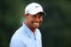 AKRON, OH - AUGUST 03: Tiger Woods smiles while on the practice range prior to the Third Round of the World Golf Championships-Bridgestone Invitational at Firestone Country Club South Course on August 3, 2013 in Akron, Ohio. (Photo by Sam Greenwood/Getty Images)