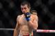 Aug 3, 2013; Rio De Janeiro, Brazil; Chan Sung Jung (blue gloves) reacts during his fight against Jose Aldo during UFC 163 at HSBC Arena. Mandatory Credit: Jason Silva-USA TODAY Sports