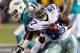 Aug 4, 2013; Canton, OH, USA; Dallas Cowboys outside linebacker DeVonte Holloman (57) intercepts a pass against Miami Dolphins wide receiver Chad Bumphis (16) and returns it for a touchdown during the second quarter at Fawcett Stadium. Mandatory Credit: Ron Schwane-USA TODAY Sports