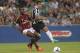 Carlos Tevez battles AC Milan's Kevin Constant at the TIM Trophy tournament.