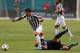 MIAMI GARDENS, FL - AUGUST 06: Carlos Alberto Tevez #10 of Inter Milan is tripped by Emanuel Mauro #9 of Juventus during an International Champions Cup Seventh Place Match at Sun Life Stadium on August 6, 2013 in Miami Gardens, Florida. (Photo by Mike Ehrmann/Getty Images)
