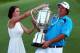 ROCHESTER, NY - AUGUST 11: Jason Dufner of the United States and his wife Amanda pose with the Wanamaker Trophy on the 18th green after his two-stroke victory at the 95th PGA Championship at Oak Hill Country Club on August 11, 2013 in Rochester, New York. (Photo by Streeter Lecka/Getty Images)