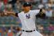 NEW YORK, NY - AUGUST 12: Hiroki Kuroda #18 of the New York Yankees pitches in the first inning against the Los Angeles Angels of Anaheim at Yankee Stadium on August 12, 2013 in the Bronx borough of New York City. (Photo by Mike Stobe/Getty Images)