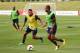 BURTON-UPON-TRENT, ENGLAND - AUGUST 12: Theo Walcott of England takes on Alex Oxlade-Chamberlain during a training session at St Georges Park on August 12, 2013 in Burton-upon-Trent, England. (Photo by Alex Livesey/Getty Images)