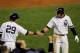 NEW YORK - OCTOBER 19: Alex Rodriguez #13 (R) of the New York Yankees celebrates with Francisco Cervelli #29 after Rodriguez scored in the bottom of the fourth inning against the Texas Rangers in Game Four of the ALCS during the 2010 MLB Playoffs at Yankee Stadium on October 19, 2010 in the Bronx borough of New York City. (Photo by Nick Laham/Getty Images)