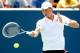 CINCINNATI, OH - AUGUST 16: Tomas Berdych of Czech Republic returns a shot to Andy Murray of Great Britain during the Western & Southern Open on August 16, 2013 at Lindner Family Tennis Center in Cincinnati, Ohio. (Photo by Matthew Stockman/Getty Images)