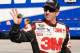 Greg Biffle waves to fans from the Daytona garage. Credit: Dwight Drum
