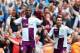LONDON, ENGLAND - AUGUST 17: Christian Benteke of Aston Villa (L) celebrates scoring his side's second goal from the penalty spot with team mate Antonio Luna during the Barclays Premier League match between Arsenal and Aston Villa at Emirates Stadium on August 17, 2013 in London, England. (Photo by Clive Mason/Getty Images)