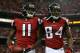 ATLANTA, GA - JANUARY 20: Wide receiver Julio Jones #11 and wide receiver Roddy White #84 of the Atlanta Falcons celebrate after Jones catches a 20-yard touchdown catch in the second quarter against the San Francisco 49ers in the NFC Championship game at the Georgia Dome on January 20, 2013 in Atlanta, Georgia. (Photo by Streeter Lecka/Getty Images)