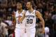 SAN ANTONIO, TX - JUNE 11: Manu Ginobili #20 and Tim Duncan #21 of the San Antonio Spurs celebrate in the third quarter while taking on the Miami Heat during Game Three of the 2013 NBA Finals at the AT&T Center on June 11, 2013 in San Antonio, Texas. NOTE TO USER: User expressly acknowledges and agrees that, by downloading and or using this photograph, User is consenting to the terms and conditions of the Getty Images License Agreement. (Photo by Mike Ehrmann/Getty Images)