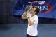 NEW YORK, NY - SEPTEMBER 10: Andy Murray of Great Britain kisses the US Open championship trophy after defeating Novak Djokovic of Serbia in the men's singles final match on Day Fifteen of the 2012 US Open at USTA Billie Jean King National Tennis Center on September 10, 2012 in the Flushing neighborhood of the Queens borough of New York City. Murray defeated Djokovic 7-6, 7-5, 2-6, 3-6, 6-2. (Photo by Alex Trautwig/Getty Images)