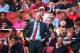 LONDON, ENGLAND - AUGUST 17: Arsene Wenger of Arsenal looks on as a fan behind makes his feelings known during the Barclays Premier League match between Arsenal and Aston Villa at Emirates Stadium on August 17, 2013 in London, England. (Photo by Clive Mason/Getty Images)