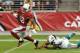 GLENDALE, AZ - SEPTEMBER 30: Andre Roberts #12 of the Arizona Cardinals scores a touchdown after breaking a tackle by Richard Marshall #31 of the Miami Dolphins at University of Phoenix Stadium on September 30, 2012 in Glendale, Arizona. (Photo by Norm Hall/Getty Images)