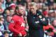 SWANSEA, WALES - AUGUST 17: David Moyes (R) the manager of Manchester United passes on final instructions as Wayne Rooney (L) comes on as a substitute during the Barclays Premier League match between Swansea City and Manchester United at the Liberty Stadium on August 17, 2013 in Swansea, Wales. (Photo by Michael Steele/Getty Images)