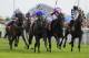 YORK, ENGLAND - AUGUST 25: Frankie Dettori riding Willing Foe (C, blue) win The Betfred Ebor from Royal Diamond (red/white cap) at York racecourse on August 25, 2012 in York, England. (Photo by Alan Crowhurst/Getty Images)
