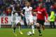 SWANSEA, WALES - AUGUST 17: Wayne Rooney (R) of Manchester United runs at Nathan Dyer (L) of Swansea City as Chico Flores (C) looks on during the Barclays Premier League match between Swansea City and Manchester United at the Liberty Stadium on August 17, 2013 in Swansea, Wales. (Photo by Michael Steele/Getty Images)