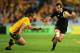 SYDNEY, AUSTRALIA - AUGUST 17: Conrad Smith of the All Blacks breaks the tackle of Ben Alexander of the Wallabies during The Rugby Championship Bledisloe Cup match between the Australian Wallabies and the New Zealand All Blacks at ANZ Stadium on August 17, 2013 in Sydney, Australia. (Photo by Brendon Thorne/Getty Images)