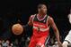 NEW YORK, NY - APRIL 15: John Wall #2 dribbles the ball against the Brooklyn Nets at the Barclays Center on April 15, 2013 in New York City. The Nets defeated the Washington Wizards 106-101. NOTE TO USER: User expressly acknowledges and agrees that, by downloading and/or using this photograph, user is consenting to the terms and conditions of the Getty Images License Agreement. (Photo by Bruce Bennett/Getty Images)