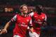 LONDON, ENGLAND - AUGUST 27: Aaron Ramsey (L) of Arsenal celebrates with team mate Yaya Sanogo after scoring his sides second goal during the UEFA Champions League Play Off Second leg match between Arsenal FC and Fenerbahce SK at Emirates Stadium on August 27, 2013 in London, England. (Photo by Michael Regan/Getty Images)