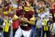 Aug 19, 2013; Landover, MD, USA; Washington Redskins quarterback Kirk Cousins (12) rolls out during the first half against the Pittsburgh Steelers at FedEX Field. Mandatory Credit: Brad Mills-USA TODAY Sports