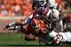 CLEMSON, SC - OCTOBER 20: Teammates Jack Tyler #58 and Kyshoen Jararett #34 tackle Sammy Watkins #2 of the Clemson Tigers during their game at Clemson Memorial Stadium on October 20, 2012 in Clemson, South Carolina. (Photo by Streeter Lecka/Getty Images)