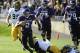 EVANSTON, IL - OCTOBER 27: Kain Colter #2 of the Northwestern Wildcats is tackled by B.J. Lowery #19 of the Iowa Hawkeyes on October 27, 2012 at Ryan Field in Evanston, Illinois. (Photo by David Banks/Getty Images)
