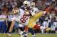 SAN DIEGO, CA - AUGUST 29: Vance McDonald #89 of the San Francisco 49ers leaves his feet to avoid a tackle in front of Andrew Gachkar #59 of the San Diego Chargers during the first quarter of a preseason game at Qualcomm Stadium on August 29, 2013 in San Diego, California. (Photo by Harry How/Getty Images)
