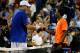 John Isner shaking hands with Gael Monfils after epic Thursday night match