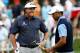 NORTON, MA - AUGUST 30: Tiger Woods (R) and Phil Mickelson of the USA react on the 11th green during the first round of the Deutsche Bank Championship at TPC Boston on August 30, 2013 in Norton, Massachusetts. (Photo by Jim Rogash/Getty Images)